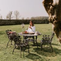 Brushed Gold "Wootton House" Four Seat Dining Set in Garden Setting 