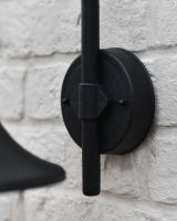 Close up of fixing detail on garden wall light Close up of fixing detail on garden wall light