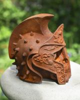 side profile of cast iron roman gladiator skull garden ornament