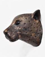 Side view of copper leopard animal wall bust 