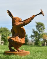 side view of hare with trumpet garden statue side view of hare with trumpet garden statue