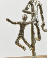 Close up of child on home decor sculpture