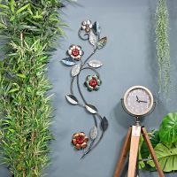 Silver Metallic Flower Wall Art in Situ on a Blue Wall Silver Metallic Flower Wall Art in Situ on a Blue Wall