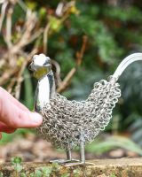 Scale Shot of Silver Rooster Wire Sculpture