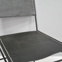 Close-up of the Black Leather on the Seat of the Chair Close-up of the Black Leather on the Seat of the Chair