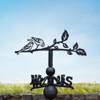 Siskin weathervane in a summery setting Siskin weathervane in a summery setting