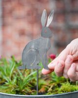Sitting Hare Artistic Plant Pot Spike - Set of Two with hand in shot for scale