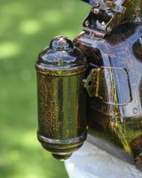 Close up of Sitting Robot Recycled Metal Sculpture Back