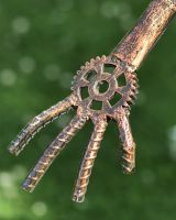 Close up of Sitting Robot Recycled Metal Sculpture hand