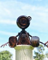 Scale image of Sitting Robot Recycled Metal Sculpture