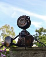 Sitting Robot Recycled Metal Sculpture Three Quarter View