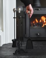 Scale image of skull detail on fireside companion set