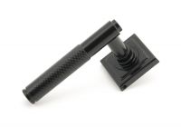 Sleek Black Textured Unsprung Lever Door Handle on Square Rose Handle