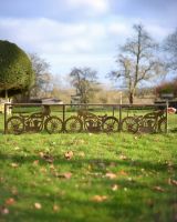 ‘Bullet’ Rustic Wall Art of a Vintage Motorbike to scale with hand holding wall art upright
