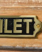 Solid Brass Toilet Plaque Sign Close Up Detail