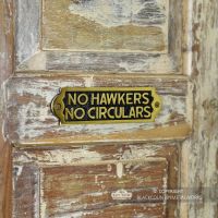 Side View of the "No Hawkers No Circulars" Sign