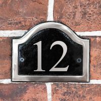 Vinyl Black & Chrome Arched Number Sign in situ on the Frpont of a House