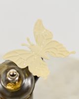 "Sprocket" the Upcycled Metal Home Ornament close up of cream butterfly