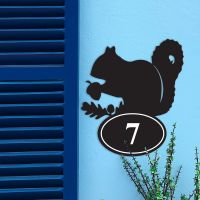 Squirrel Iron House Number Sign in Situ on a Blue Wall