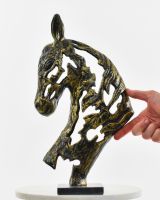 Steed"s Shadow Cast Aluminium Interior Ornament - Gold with hand in shot for scale