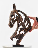 Steed"s Shadow Cast Aluminium Interior Ornament with hand in shot for scale