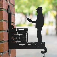 Steel Bricklayer Hanging Basket Bracket in Situ on a Red Brick Wall Steel Bricklayer Hanging Basket Bracket in Situ on a Red Brick Wall