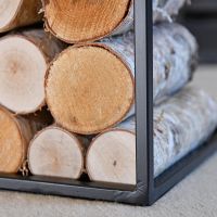 Close-up of the "Town House" Iron Log Rack Holding Logs Close-up of the "Town House" Iron Log Rack Holding Logs