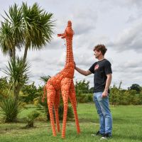 Scale Shot of Steel "Lady Jengo" Baby Giraffe Sculpture - Orange