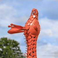 Close-Up of Orange Steel "Lady Jengo" Baby Giraffe Sculpture