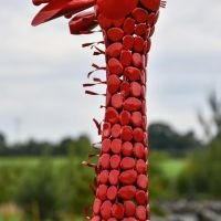 Close-Up of Steel "Lady Jengo" Baby Giraffe Sculpture - Red Close-Up of Steel "Lady Jengo" Baby Giraffe Sculpture - Red