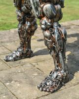 Close up of intricate leg detail on scrap metal art sculpture