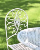 Situ Shot of Singular Seat for Stunning Sunrise Outdoor Two Seater Bistro Set with Spiral Detailing