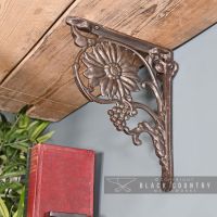 Sunflower Iron Shelf Bracket Holding up a Wooden Shelf
