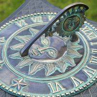 Beautiful antique sundial with large sun face