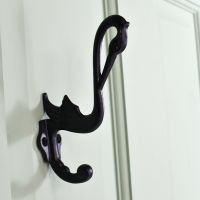 Black Swan Design Coat hook on a Green Surface