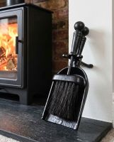The Traditional Black Iron Pan & Brush Set on a Stone Tile Hearth next to a Log Burner Stove - Digital Illustration The Traditional Black Iron Pan & Brush Set on a Stone Tile Hearth next to a Log Burner Stove - Digital Illustration