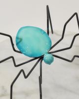 Close up of body detail on colourful enamel sculpture