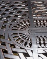 The "Highgrove" 8-Seater Luxury Garden Dining Set - Antique Copper Table Lower Table Centre Design Close Up The "Highgrove" 8-Seater Luxury Garden Dining Set - Antique Copper Table Lower Table Centre Design Close Up