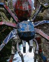 Tarantula Upcycled Oil Drum Garden Sculpture hanging from a tree close up image