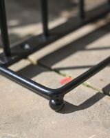 The 4-Pair Welly Boot Rack Stand Showing a Close up of the Curved Base