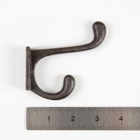 The 90mm Compact Cotswold Antique Iron Coat Hook On a White Background  with a Ruler for Scale - Digital Illustration
