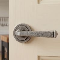 The Ayre Gardens Aged Pewter Unsprung Lever Door Handle on Art Deco Rose on a Classic Cream Coloured Door in a Country Home - Digital Illustration