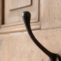 The Blacksmith Antique Iron Two-Prong Coat Hook - 110mm Showing the Rounded Top Hook - Digital Illustration
