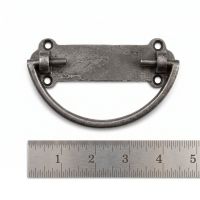 The Blacksmith Curved Loop Drop Pull 105mm x 35mm on a White Background next to a Steel Ruler for Scale - Digital Illustration
