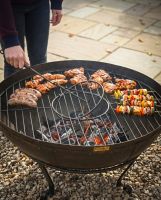 The Circular Kadai Grill Grate with Removable Centre Shown with Centre of the Grill Being Lifted Out - Digital Illustration