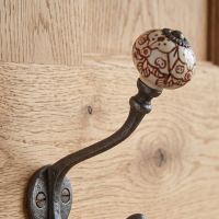 The Cotswold Ceramic Knob Cast Antique Iron Hat & Coat Hook Showing a Close of the Ceramic Finial - Digital Illustration