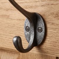 The Cotswold Circular Backplate Cast Iron Coat Hook 110mm Showing a Close up of the Lower Hook - Digital Illustration