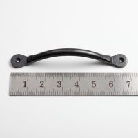The Cotswold Penny End Arched Pull Handle - 180mm on a White Background next to a Steel Ruler for Scale - Digital Illustration