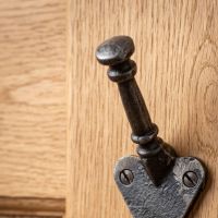 The Craftsman Minimalist Cast Iron Hook - 100mm Showing a Close up of the End of the Hook - Digital Illustration