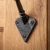 The Craftsman Minimalist Cast Iron Hook - 100mm Showing a Close up of the Triangular Base - Digital Illustration